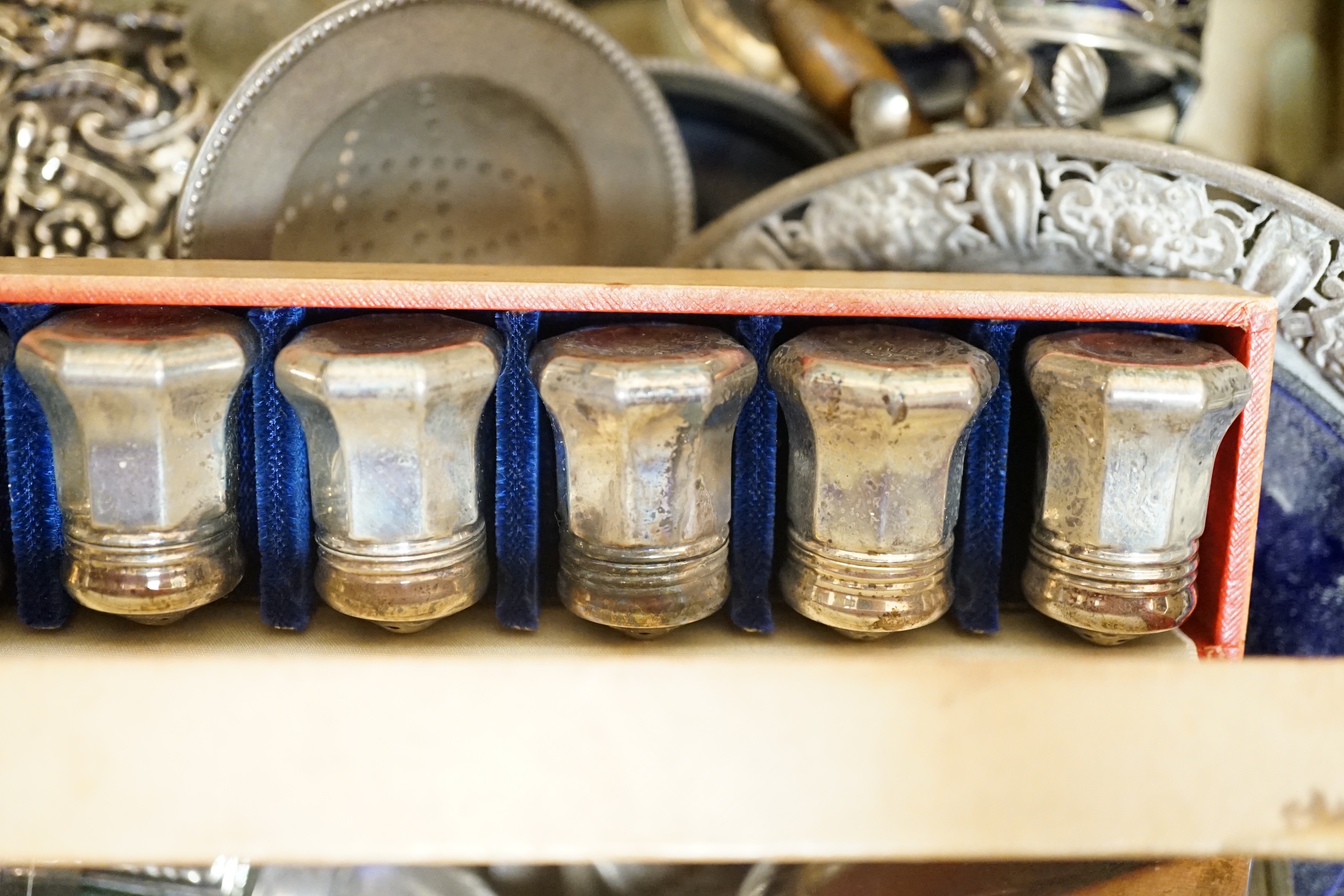 Sundry silver including a boxed set of eight Cartier sterling condiments 37mm, cigarette box, goblet, dish with blue glass liner, bowl, tumbler cup, flatware, mounted glass oil and vinegar bottle, etc.